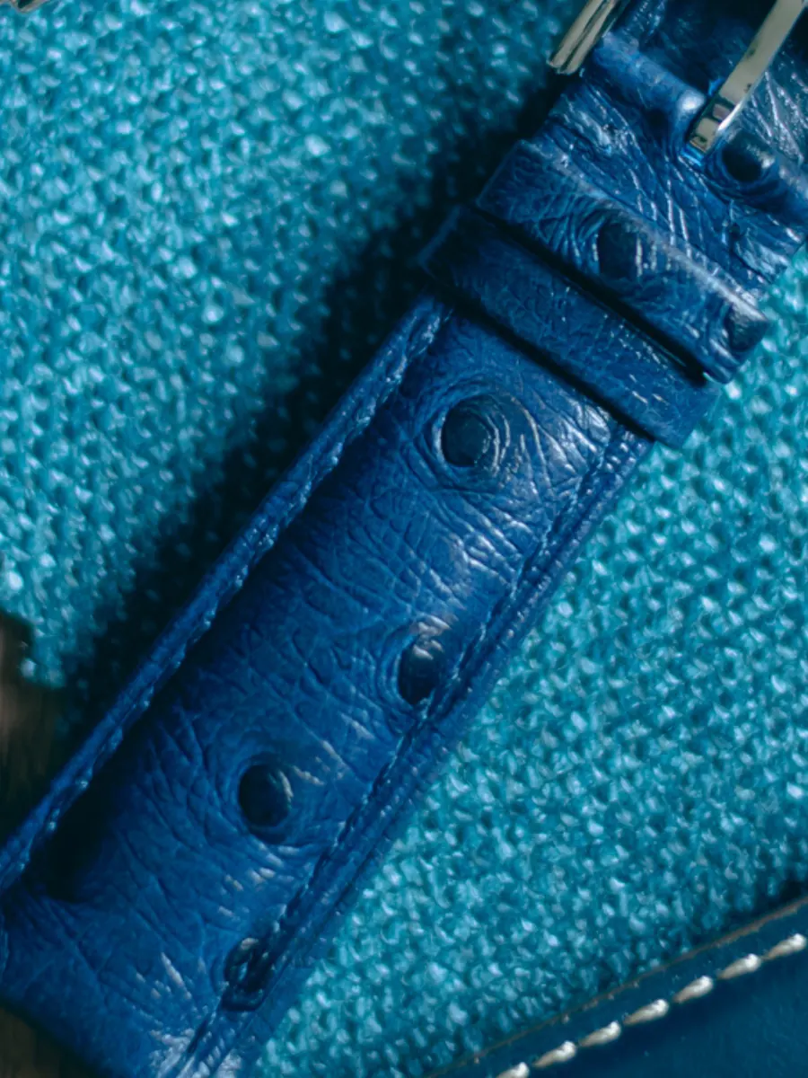 Blue ostrich leather strap detail Close-up of blue ostrich leather watch strap showing quill pattern