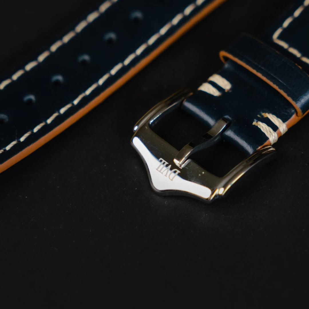 Navy leather strap with cream stitching and polished DVIL buckle